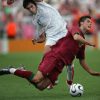 Frankfurt am Main, GERMANY:  Portuguese forward Cristiano Ronaldo (R) goes airborne challenged by Iranian midfielder Mehrzad Madanchi (L) during the World Cup 2006 group D football game Portugual vs.Iran 17 June 2006 at  Frankfurt stadium. AFP PHOTO BEHROUZ MEHRI  (Photo credit should read BEHROUZ MEHRI/AFP/Getty Images)