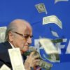 Banknotes-are-thrown-at-FIFA-President-Blatter-as-he-arrives-for-a-news-conferen[1]